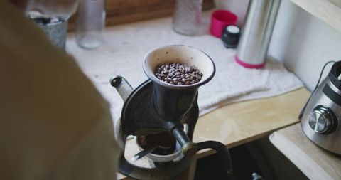 Grinding Coffee Beans in Vintage Kitchen Coffee Mill - Download Free Stock Images Pikwizard.com