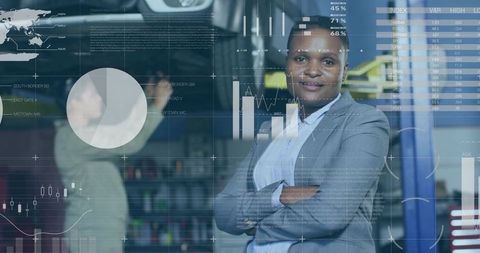 Confident businesswoman crossing arms in tech workspace with digital analytics overlay