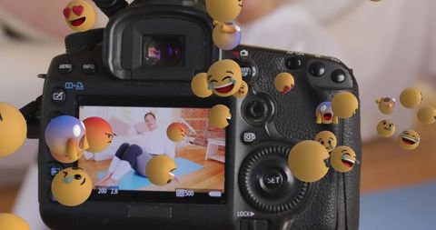 Fitness vlogger with floating emojis streaming workout at home