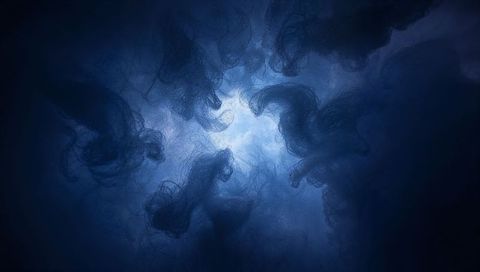 Glowing nebula cluster emitting layered translucent filaments in moody deep-blue abstract