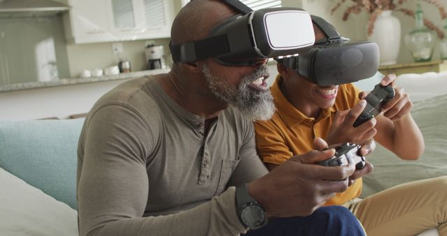 Father and son wearing virtual reality headsets, immersed in a gaming experience in a modern living room. They are holding controllers and appear to be enjoying a fun, interactive moment together. Suitable for themes around family bonding, VR technology, leisure activities, and modern home entertainment.