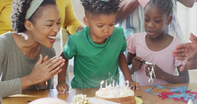 Joyful Family Birthday Celebration with Young Boy - Download Free Stock Images Pikwizard.com