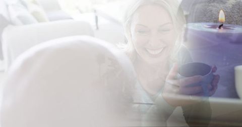 Happy Couple Enjoying Coffee at Home with Candle Ambiance