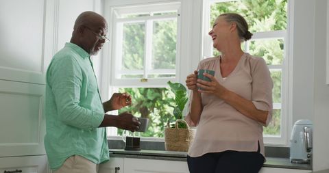 Happy Senior Couple with Coffee in Bright Kitchen - Download Free Stock Images Pikwizard.com