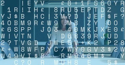 Mid adult woman leaning at conference table presenting digital data overlay for boardroom