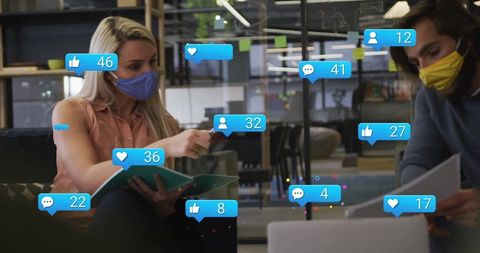 Masked Colleagues Engaging in Modern Office Collaboration