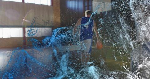 Basketball Player Dribbling with Digital Particle Effect