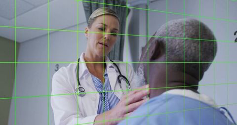 Caring Female Doctor Discussing with Patient in Examination Room
