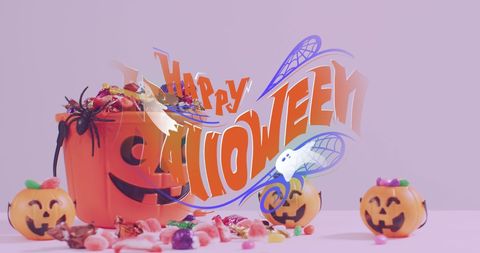 Colorful Halloween Candy Spill with Festive Pumpkin Bucket - Download Free Stock Images Pikwizard.com