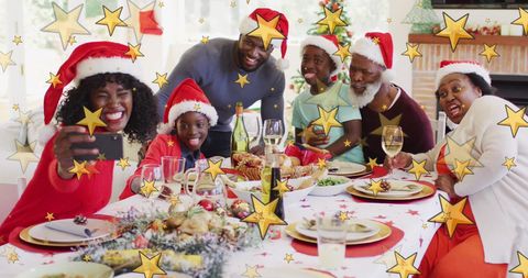 Family Enjoying Christmas Meal and Taking Selfie Together