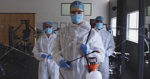 Sanitation team disinfecting gym interior