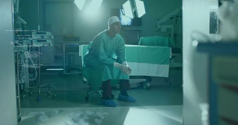 Surgeon Contemplative in Operating Room Healthcare Setting