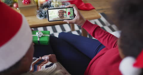 Festive Video Call with Christmas Decor and Present Exchange