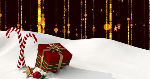 Christmas gifts and candy canes in snow scene