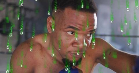 Shirtless boxer training and focusing in ring with digital binary code overlay