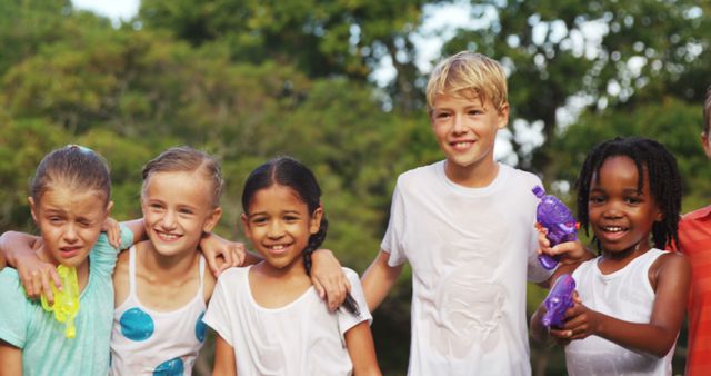 Group of Smiling Children Playing with Water on a Sunny Day - Download Free Stock Images Pikwizard.com