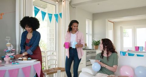 Women Celebrating Joyful Baby Shower at Home