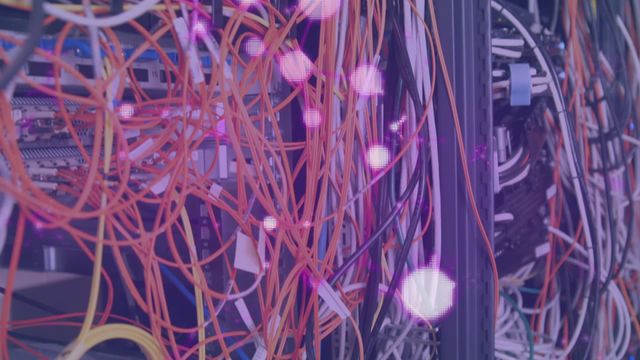 This video showcases colorful cables connected to computer servers with vibrant digital effects flying around. Useful for content on IT infrastructure, data centers, global computing, and network hardware. Excellent for illustrating modern technology concepts, data processing, and connectivity in digital marketing and educational materials.