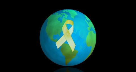 Yellow ribbon on globe signifying global awareness