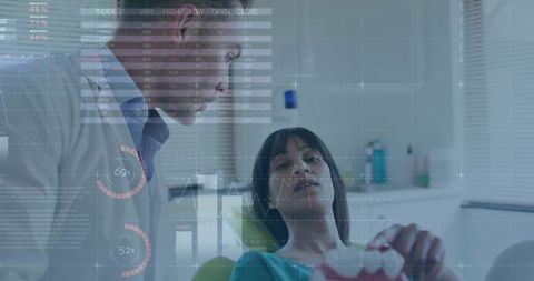 Dentist Explaining Treatment with Futuristic Digital HUD Overlay during Dental Exam