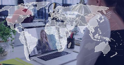 Remote video call on laptop with world map overlay for global team collaboration