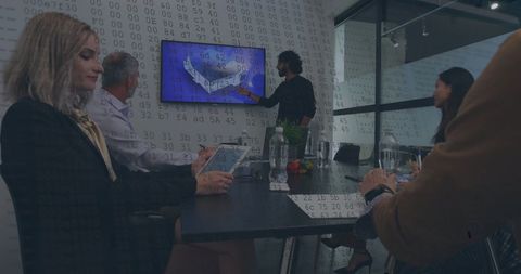 Diverse Team Analyzing Financial Data on Modern Screen