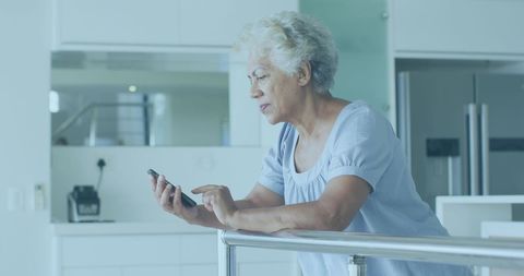 Senior African Woman Interacting with Smartphone