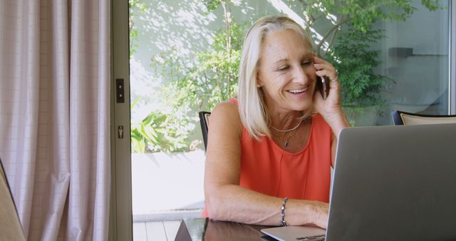 Elderly Woman Using Laptop and Phone at Home Office - Download Free Stock Images Pikwizard.com