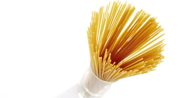 Uncooked Spaghetti Sticking Out from Glass Container - Download Free Stock Images Pikwizard.com