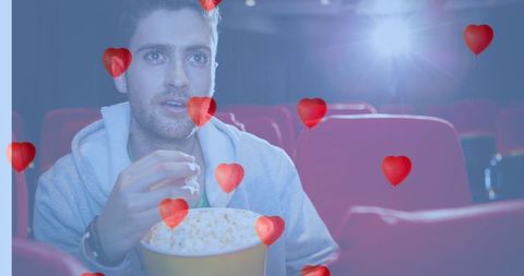 Romantic cinema experience with popcorn and hearts