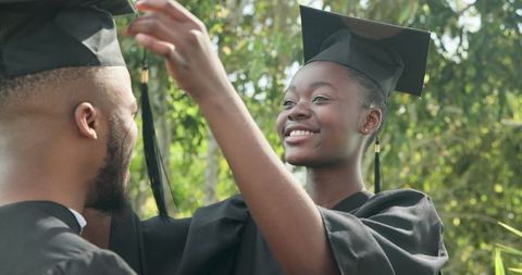 Joyful College Graduates Celebrating Achievement Outdoors