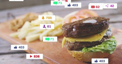 Double cheeseburger with fries showing social media engagement badges