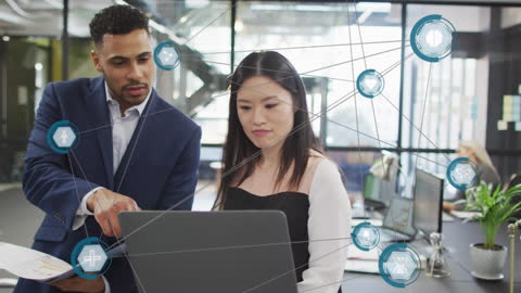 Business Professionals Analyzing Network Connections in Modern Office