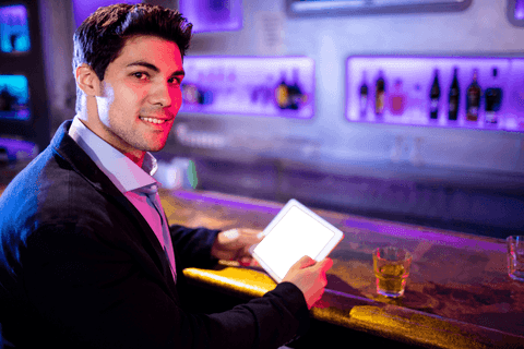 businessman opening tablet in modern bar with transparent smile - Download Free Stock Videos Pikwizard.com