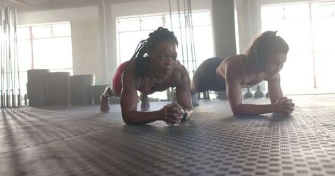 Two Women Doing Plank Exercise in Gym Training Session - Download Free Stock Images Pikwizard.com