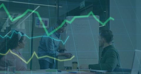 Presenter Pointing at Flip Chart While Team Brainstorming with Data Charts in Modern Office
