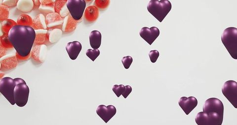 Floating Violet 3D Hearts Drifting Over White Backdrop with Red and White Sugared Gummies