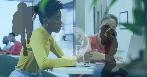 Diverse Female Colleagues Analyzing Data with Sports Overlay