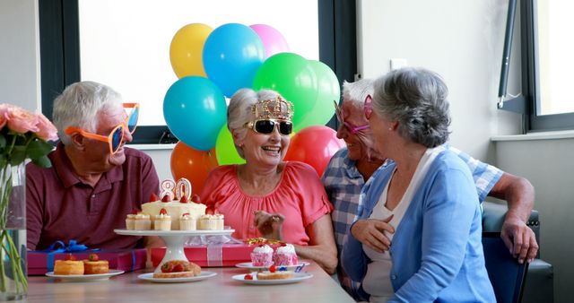 Senior citizens celebrating birthday party at home