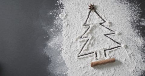 Christmas tree drawn in flour with festive spices