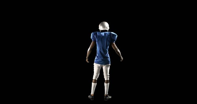 American Football Player Standing on Black Background - Download Free Stock Images Pikwizard.com