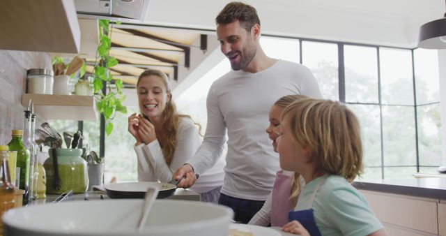 Happy Family Bonding While Cooking Breakfast in Kitchen - Download Free Stock Images Pikwizard.com