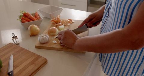 Hands preparing vegetables for healthy cooking