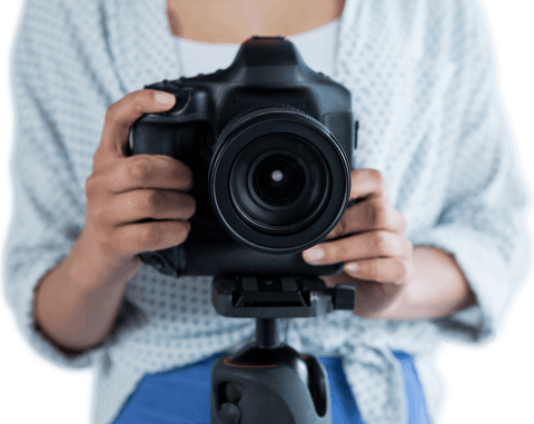 Photographer holding camera against transparent background