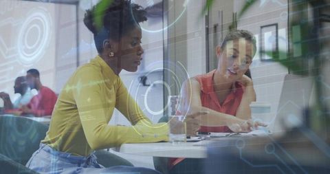 Diverse Team Collaboration in Modern Office with Digital Overlay