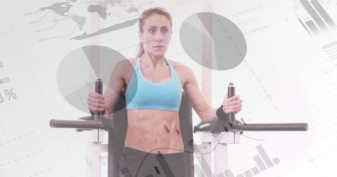 Fit Woman Exercising with Gym Equipment and Data Graphics Overlay