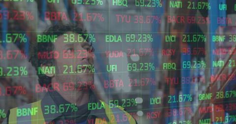 Warehouse worker analyzing digital stock market data interface