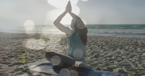 Man Meditating on Sunlit Beach Serenity and Reflection - Download Free Stock Images Pikwizard.com