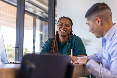 Diverse Collab in Modern Workspace with Laptops