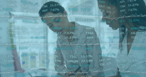 Diverse Team Analyzing Financial Data Display